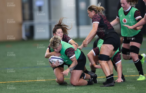 141023 - Wales Women Training Session -  Donna Rose is tackled during a rugby training session at the NZCIS in Wellington