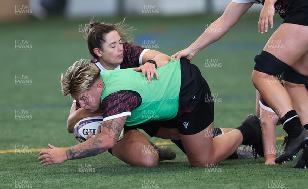 141023 - Wales Women Training Session -  Donna Rose is tackled during a rugby training session at the NZCIS in Wellington