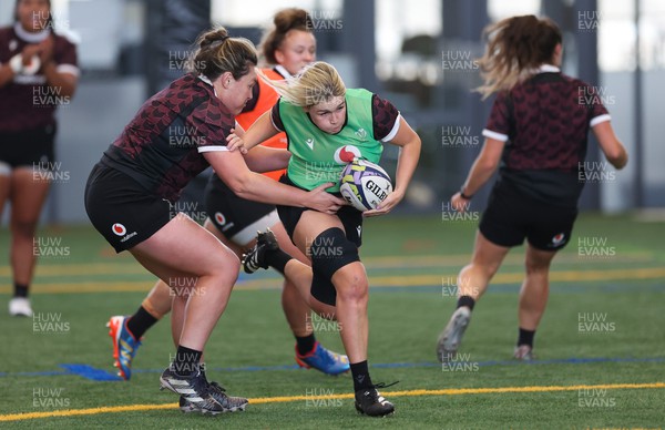 141023 - Wales Women Training Session -  Alex Callender takes on Cerys Hale during a rugby training session at the NZCIS in Wellington