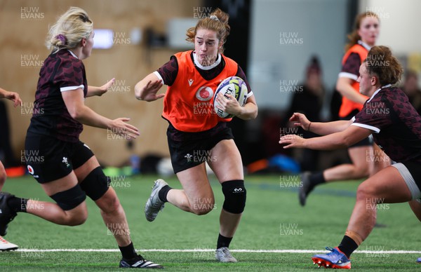 141023 - Wales Women Training Session -  Lisa Neumann takes on Alex Callender and Lleucu George during a rugby training session at the NZCIS in Wellington