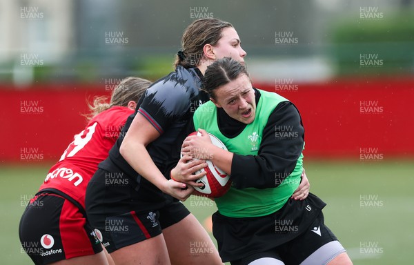 150224 - Wales Women Extended Squad Training session - Lleucu George looks to get away from Amelia Tutt during training session as preparations get under way for the Women’s 6 Nations
