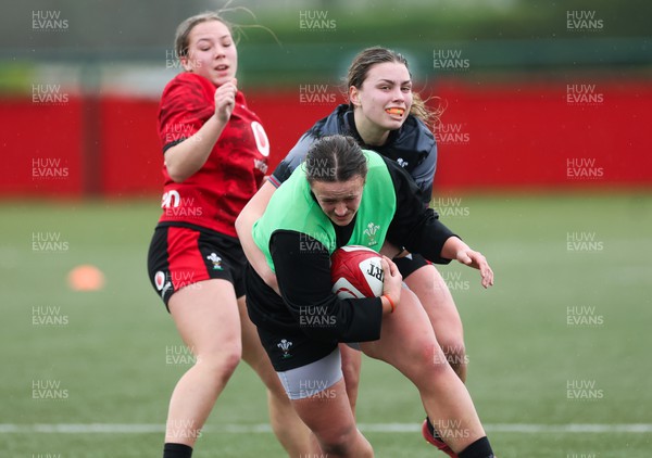 150224 - Wales Women Extended Squad Training session - Lleucu George looks to get away from Amelia Tutt during training session as preparations get under way for the Women’s 6 Nations