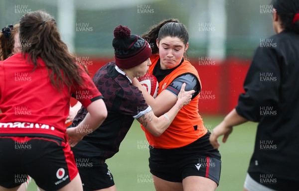 150224 - Wales Women Extended Squad Training session - Gwennan Hopkins is held by Keira Bevan during training session as preparations get under way for the Women’s 6 Nations