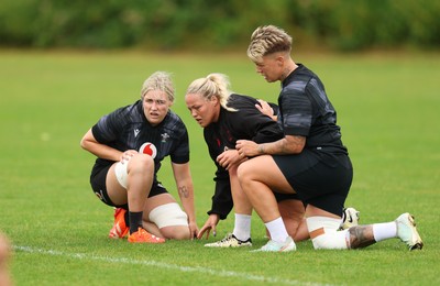 150725 - Wales Women Rugby training - Alex Callender, Kelsey Jones and Donna Rose, during a training session ahead of their two match tour against Australia   