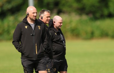 150725 - Wales Women Rugby training - Mike Hill, Wales Women forwards coach, Shaun Connor, Wales Women attack coach and Sean Lynn, Wales Women head coach, during a training session ahead of their two match tour against Australia