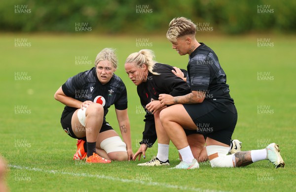 150725 - Wales Women Rugby training - Alex Callender, Kelsey Jones and Donna Rose, during a training session ahead of their two match tour against Australia   