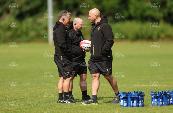 150725 - Wales Women Rugby training - Shaun Connor, Wales Women attack coach, Sean Lynn, Wales Women head coach, and Mike Hill, Wales Women forwards coach during a training session ahead of their two match tour against Australia