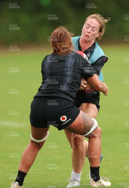 150725 - Wales Women Rugby training - Lisa Neumann is tackled by Georgia Evans during a training session ahead of their two match tour against Australia