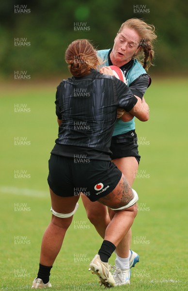 150725 - Wales Women Rugby training - Lisa Neumann is tackled by Georgia Evans during a training session ahead of their two match tour against Australia