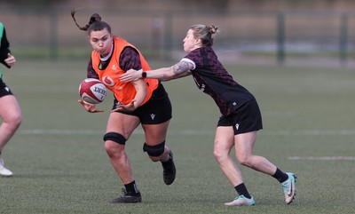 160424 - Wales Women Rugby Training - Bryonie King takes on Keira Bevan during a training session ahead of Wales’ Guinness Women’s 6 Nations match against France