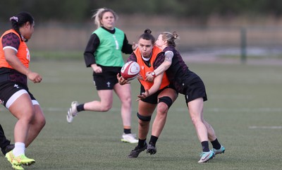 160424 - Wales Women Rugby Training - Bryonie King takes on Keira Bevan during a training session ahead of Wales’ Guinness Women’s 6 Nations match against France