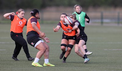 160424 - Wales Women Rugby Training - Bryonie King takes on Keira Bevan during a training session ahead of Wales’ Guinness Women’s 6 Nations match against France