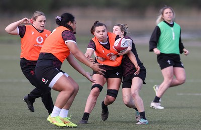 160424 - Wales Women Rugby Training - Bryonie King takes on Keira Bevan during a training session ahead of Wales’ Guinness Women’s 6 Nations match against France