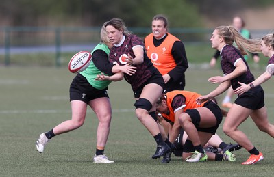 160424 - Wales Women Rugby Training - Alisha Butchers offloads during a training session ahead of Wales’ Guinness Women’s 6 Nations match against France