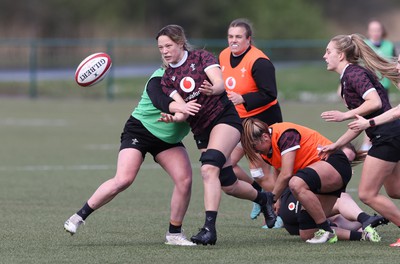 160424 - Wales Women Rugby Training - Alisha Butchers offloads during a training session ahead of Wales’ Guinness Women’s 6 Nations match against France