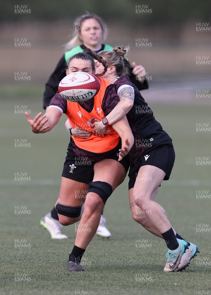 160424 - Wales Women Rugby Training - Bryonie King takes on Keira Bevan during a training session ahead of Wales’ Guinness Women’s 6 Nations match against France