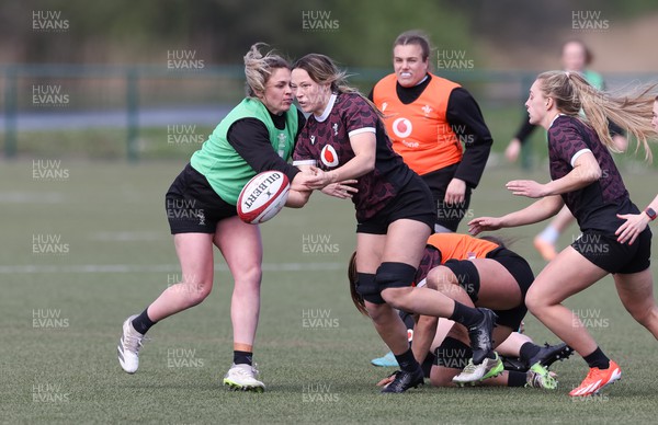 160424 - Wales Women Rugby Training - Alisha Butchers offloads during a training session ahead of Wales’ Guinness Women’s 6 Nations match against France