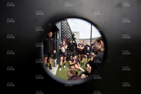 161023 - Wales Women Rugby Training Session - Ioan Cunningham delivers a team briefing during a training session at NZCIS ahead of their first WXV1 match against Canada in Wellington 