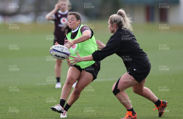 161023 - Wales Women Rugby Training Session - Megan Davies passes and Hannah Bluck closes in during a training session at NZCIS ahead of their first WXV1 match against Canada in Wellington 