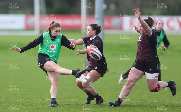 190324 - Wales Women Rugby Training - Niamh Terry is challenged by Alisha Butchers during training session ahead of the start of the Women’s 6 Nations