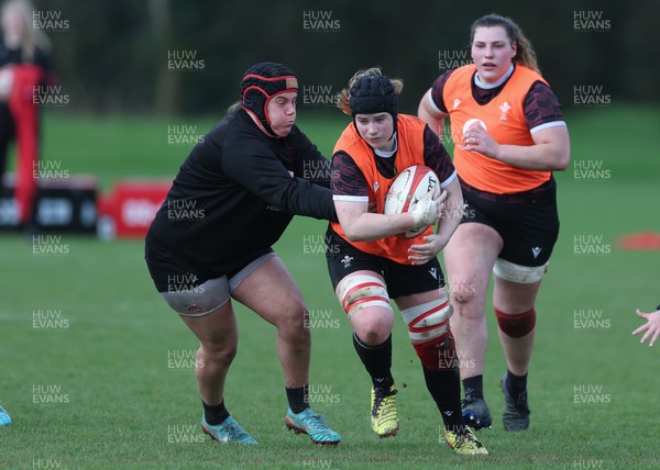 190324 - Wales Women Rugby Training - Bethan Lewis takes on Carys Phillips during training session ahead of the start of the Women’s 6 Nations