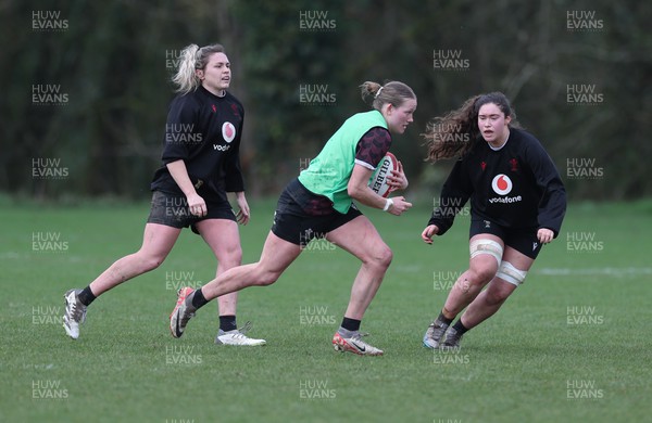 190324 - Wales Women Rugby Training - Carys Cox takes on Gwennan Hopkins during training session ahead of the start of the Women’s 6 Nations