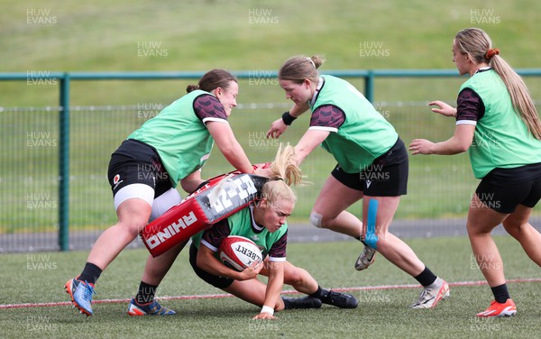 190424 - Wales Women Rugby training session - Catherine Richards with Lleucu George and Carys Cox during a training session ahead of Wales’ Guinness 6 Nations match against France