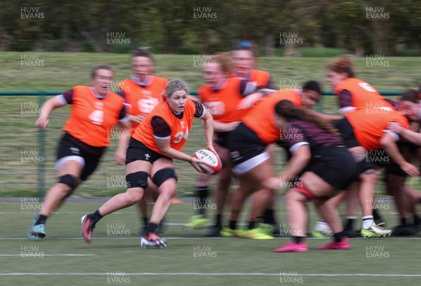 190424 - Wales Women Rugby training session - Alex Callender charges forward during a training session ahead of Wales’ Guinness 6 Nations match against France