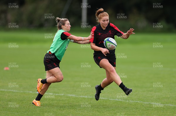 190922 - Wales Women World Cup Squad Training session - Niamh Terry kicks ahead as Keira Bevan  challenges during a training session ahead of Wales’ departure for the Women’s Rugby World Cup