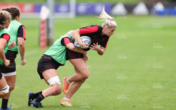 190922 - Wales Women World Cup Squad Training session - Carys Williams-Morris is tackled during a training session ahead of Wales’ departure for the Women’s Rugby World Cup
