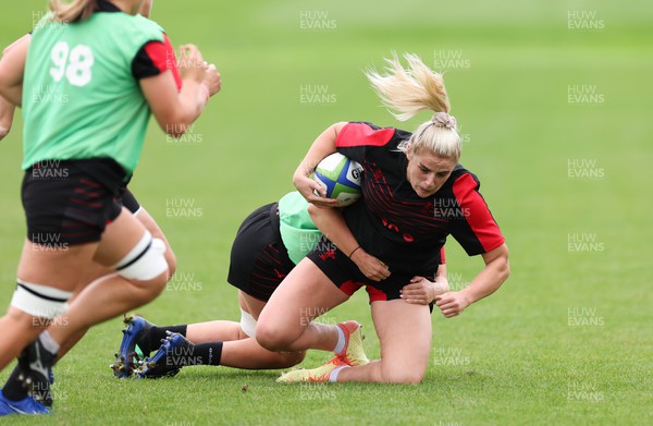 190922 - Wales Women World Cup Squad Training session - Carys Williams-Morris is tackled during a training session ahead of Wales’ departure for the Women’s Rugby World Cup