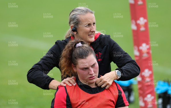 190922 - Wales Women World Cup Squad Training session - Jo Perkins treats Gwenllian Pyrs during a training session ahead of Wales’ departure for the Women’s Rugby World Cup