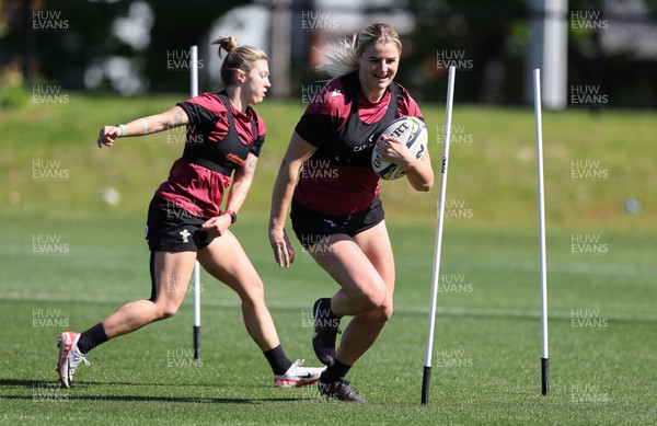 191023 - Wales Women Rugby Training Session - Carys Williams-Morris gets past Keira Bevan during a training session ahead of Wales’ opening match of WXV1 against Canada