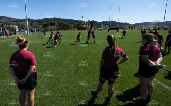 191023 - Wales Women Rugby Training Session - Team mates look on as players practice the line out during a training session ahead of Wales’ opening match of WXV1 against Canada