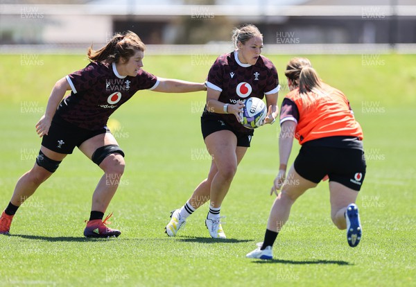191023 - Wales Women Rugby Training Session - Kelsey Jones gets past Cerys Hale during a training session ahead of Wales’ opening match of WXV1 against Canada