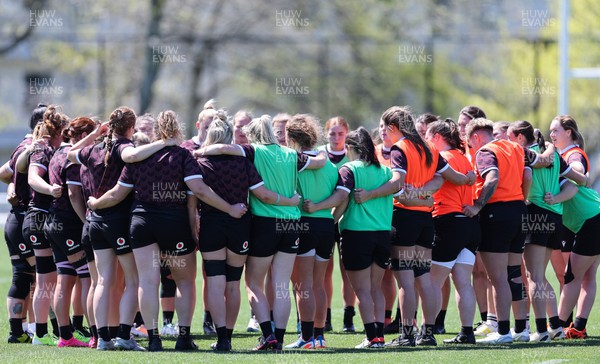 191023 - Wales Women Rugby Training Session - The Wales team huddle up during a training session ahead of Wales’ opening match of WXV1 against Canada