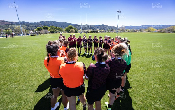 191023 - Wales Women Rugby Training Session - The Wales team huddle up during a training session ahead of Wales’ opening match of WXV1 against Canada