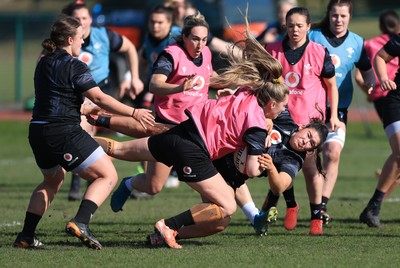 200325  Wales Women Rugby Training Session - Hannah Jones takes on Gwennan Hopkins during training session ahead of the opening match of the Women’s 6 Nations against Scotland