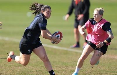 200325  Wales Women Rugby Training Session - Meg Davies takes on Keira Bevan during training session ahead of the opening match of the Women’s 6 Nations against Scotland