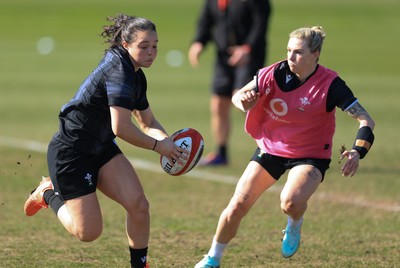 200325  Wales Women Rugby Training Session - Meg Davies takes on Keira Bevan during training session ahead of the opening match of the Women’s 6 Nations against Scotland