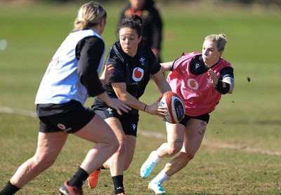 200325  Wales Women Rugby Training Session - Meg Davies takes on Keira Bevan during training session ahead of the opening match of the Women’s 6 Nations against Scotland