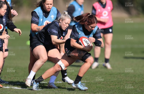 200325  Wales Women Rugby Training Session - Georgia Evans is tackled by Kelsey Jones during training session ahead of the opening match of the Women’s 6 Nations against Scotland