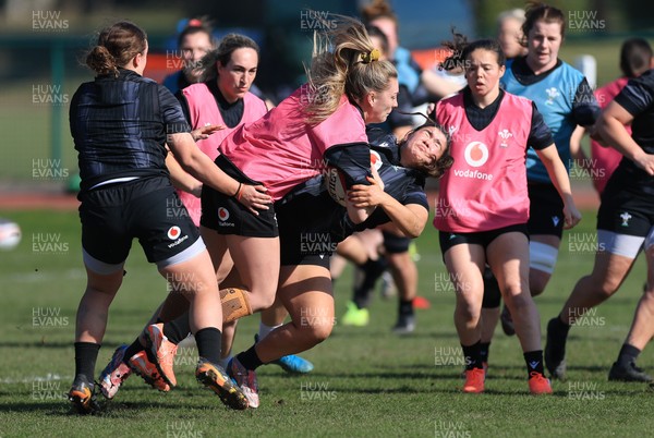 200325  Wales Women Rugby Training Session - Hannah Jones takes on Gwennan Hopkins during training session ahead of the opening match of the Women’s 6 Nations against Scotland