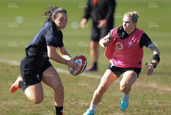 200325  Wales Women Rugby Training Session - Meg Davies takes on Keira Bevan during training session ahead of the opening match of the Women’s 6 Nations against Scotland