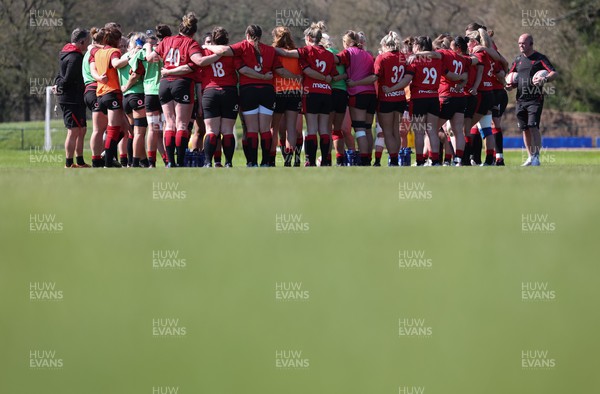 200423 - Wales Women Rugby Training Session - The Wales team huddle together during a training session ahead of the TicTok Women’s 6 Nations matches against France and Italy