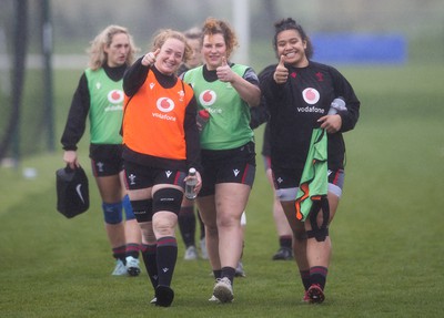 210323 - Wales Women Rugby Training Session - Abbie Fleming, Gwenllian Pyrs and Sisilia Tuipulotu walk down to a training session ahead of Wales’ opening Women’s 6 Nations match against Ireland