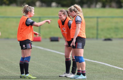 210323 - Wales Women Rugby Training Session - Elinor Snowsill, Lisa Neumann and Courtney Keight during a training session ahead of Wales’ opening Women’s 6 Nations match against Ireland