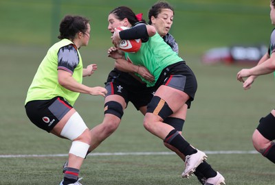 210323 - Wales Women Rugby Training Session - Georgia Evans takes on Sioned Harries during a training session ahead of Wales’ opening Women’s 6 Nations match against Ireland