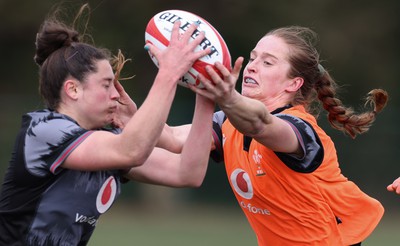 210323 - Wales Women Rugby Training Session - Robyn Wilkins and Lisa Neumann compete for the ball during a training session ahead of Wales’ opening Women’s 6 Nations match against Ireland