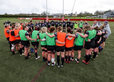 210323 - Wales Women Rugby Training Session - The Wales Women squad huddle together during a training session ahead of Wales’ opening Women’s 6 Nations match against Ireland